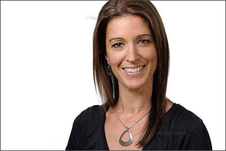 Profile portrait of Narelle Ellis taken on a white background in a photography studio.