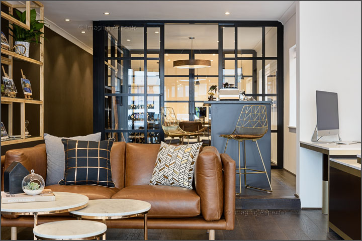 Contemporary office interior with leather lounge and glass meeting room in North Brighton, Victoria.