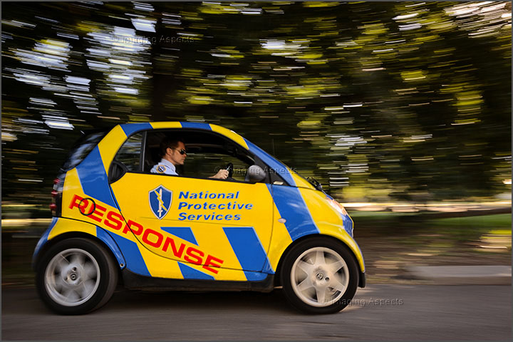 Panning photo with blurred movement of security response smart car for National Protective Services.
